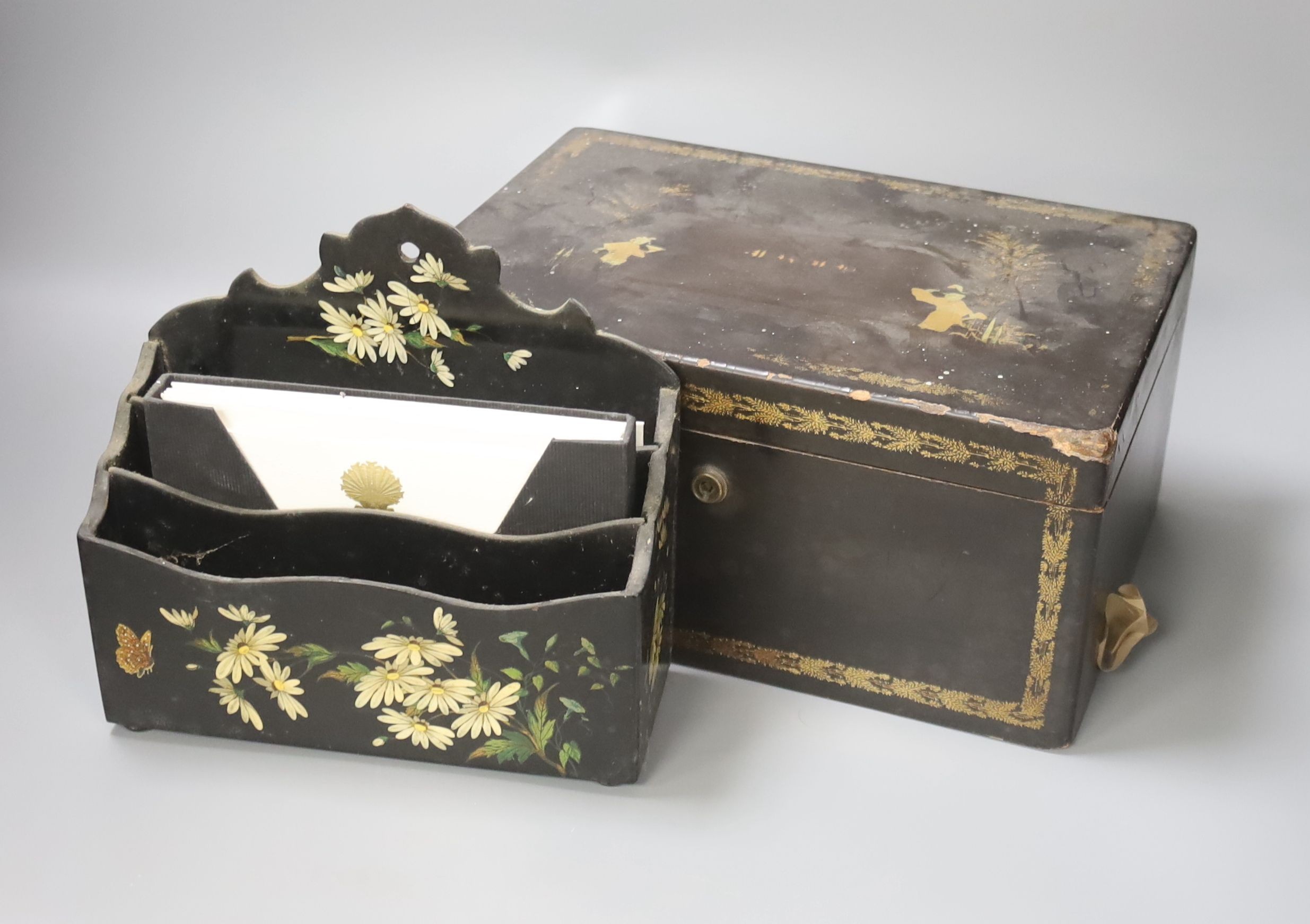 A mid 19th century Chinese export lacquer tea caddy with internal pewter canister and a japanned letter rack (2)